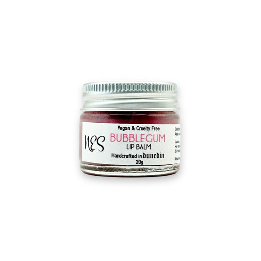 Bubblegum lip balm in a small glass jar with an aluminum lid – vegan and cruelty-free lip care from NES Soap NZ.