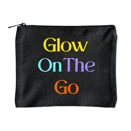 Black NES Soap beauty bag with colorful ‘Glow On The Go’ text for travel skincare and beauty storage. Handprinted in Dunedin, NZ.