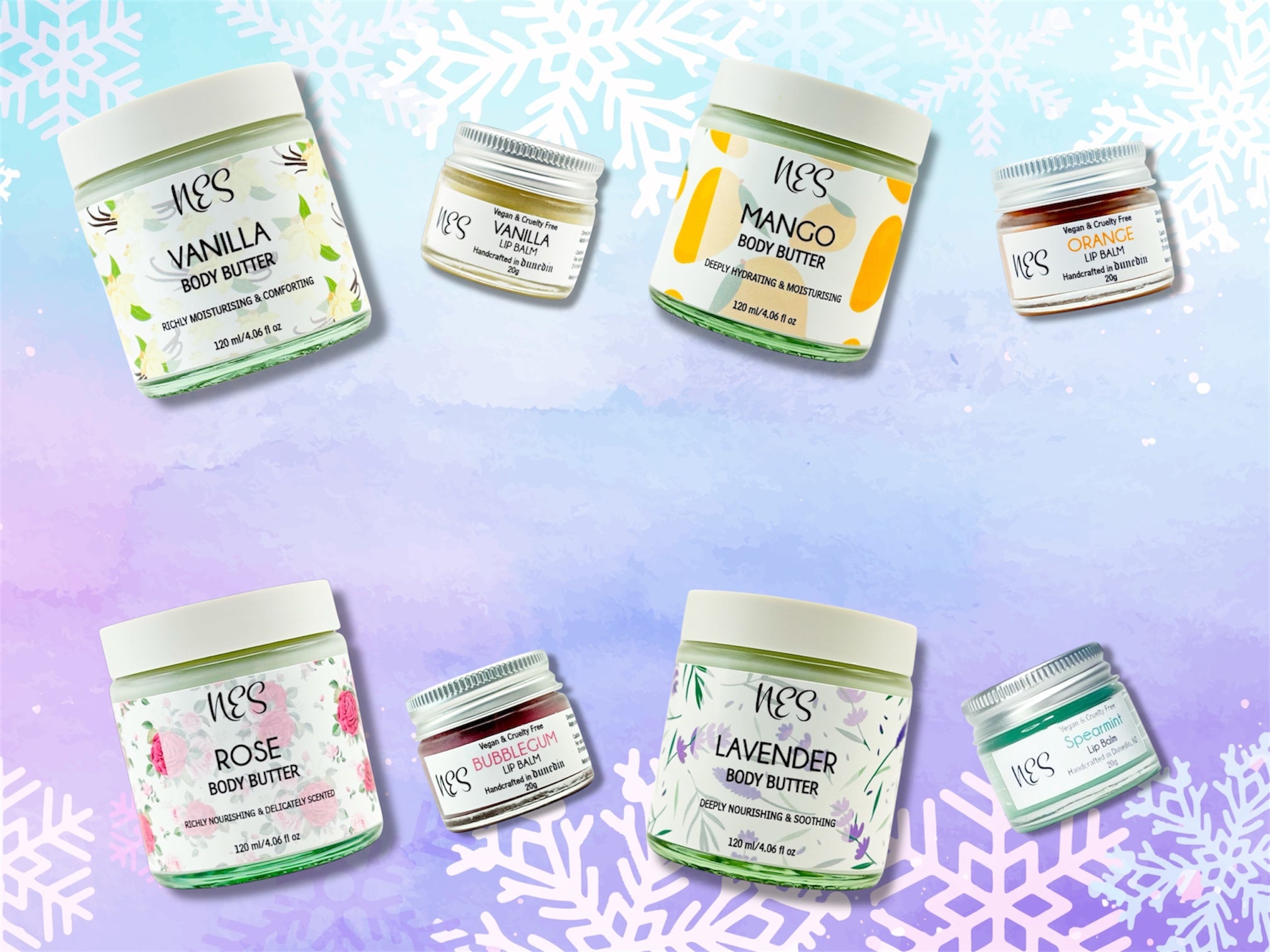 NES vegan body butters and lip balms in winter sale bundle, including mango, lavender, rose, vanilla, bubblegum, orange, and spearmint flavours on a pastel snowflake background. Perfect for dry skin and winter skincare routine.