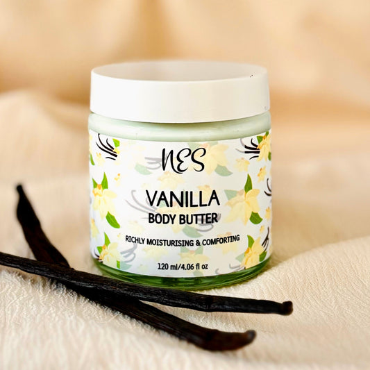 Vanilla body butter by NES Soap with vanilla pod on top of a soft cream coloured fabric. Ethical, vegan skincare handmade in Dunedin, New Zealand.