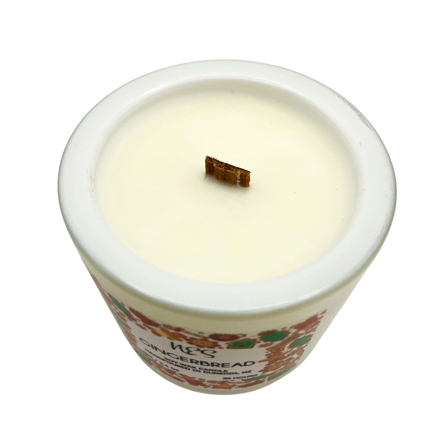 Gingerbread Candle in a decorative container with a visible brand label on a white background. Soy wax, wood wick, handpoured in Dunedin, NZ by NES Soap.