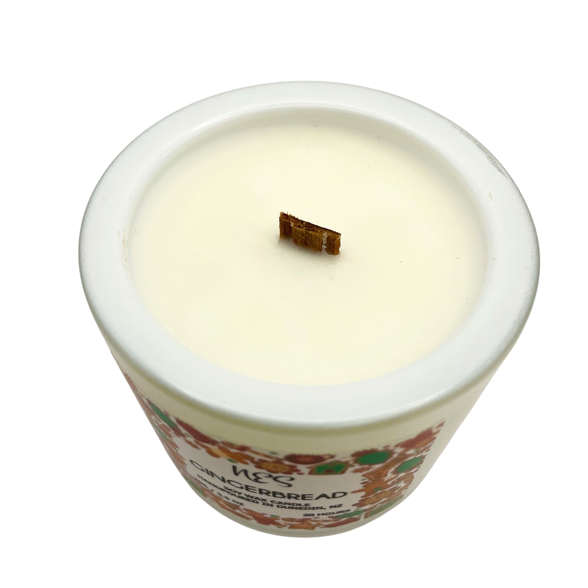 Gingerbread Candle in a decorative container with a visible brand label on a white background. Soy wax, wood wick, handpoured in Dunedin, NZ by NES Soap.