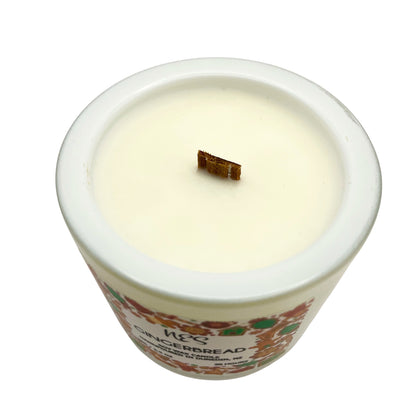 Gingerbread Candle in a decorative container with a visible brand label on a white background. Soy wax, wood wick, handpoured in Dunedin, NZ by NES Soap.