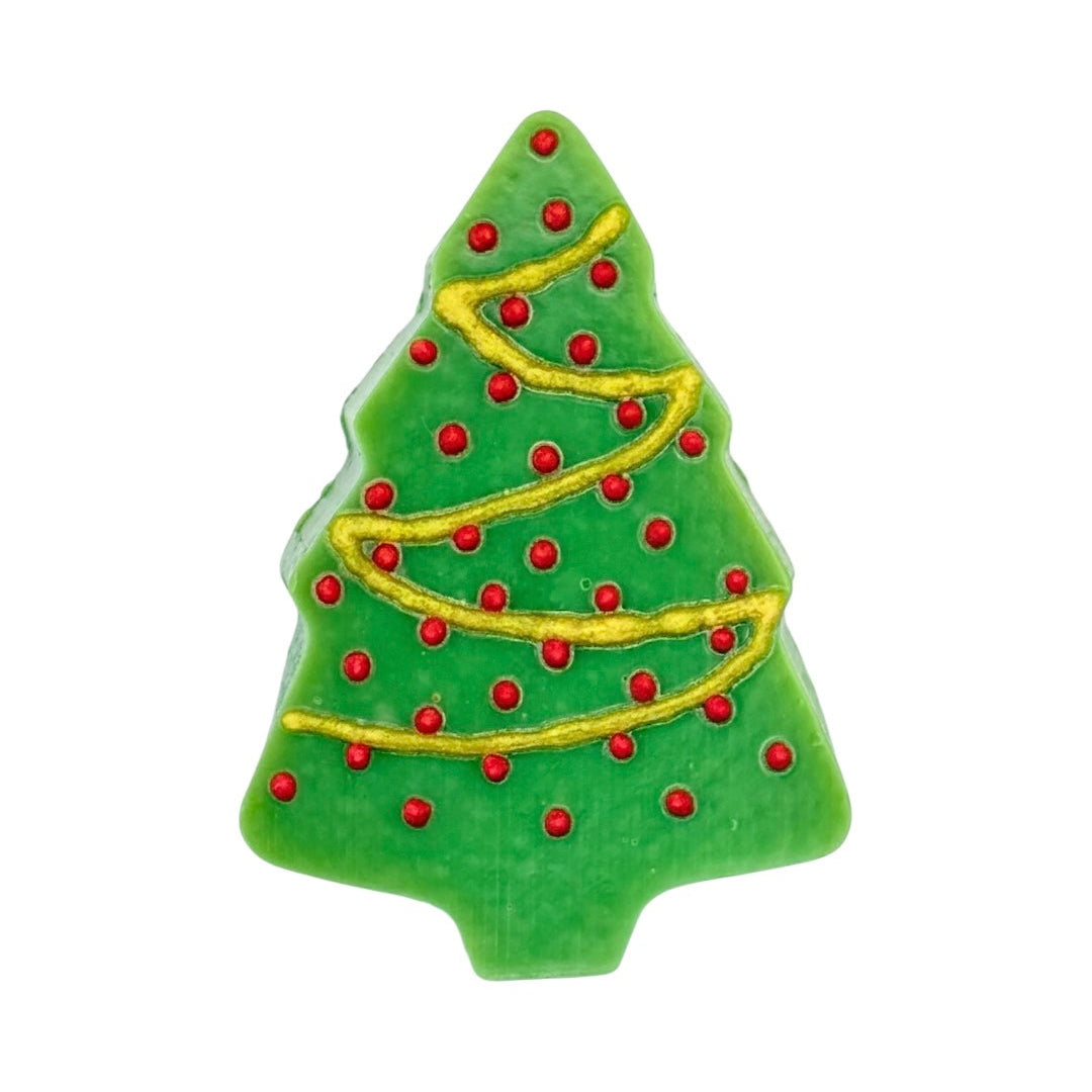 Green Christmas tree-shaped soap with red and gold decorations on a white background. Vegan and cruelty free soap, handmade in Dunedin, NZ by NES Soap