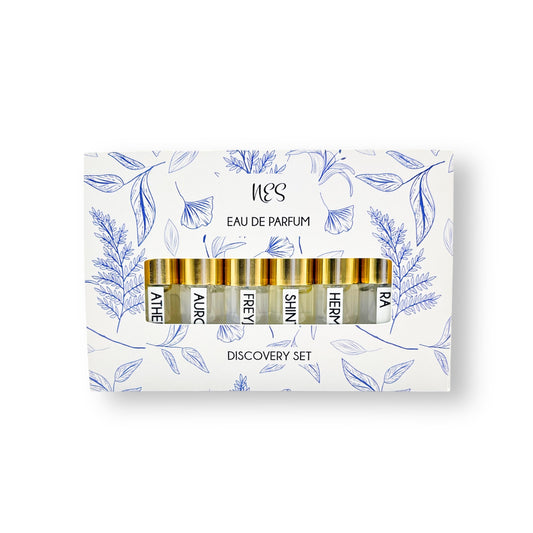 NES Soap Discovery Set in elegant white and blue floral packaging, featuring six curated perfume samples. Vegan, sustainable, and handcrafted fragrances from NES Soap NZ.